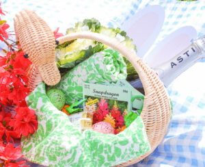 Create an adult Easter basket for friends and fill it with favorite champagne, pretty dish towels, flower seeds, and candy.