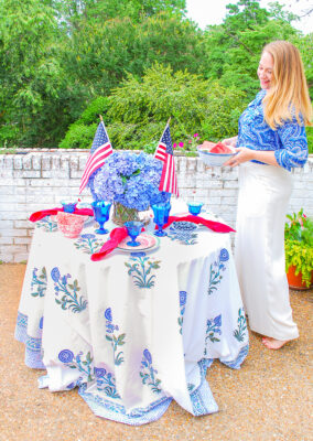 Katherine sets patriotic table with red and blue china, Fostoria goblets, and hydrangea centerpiece