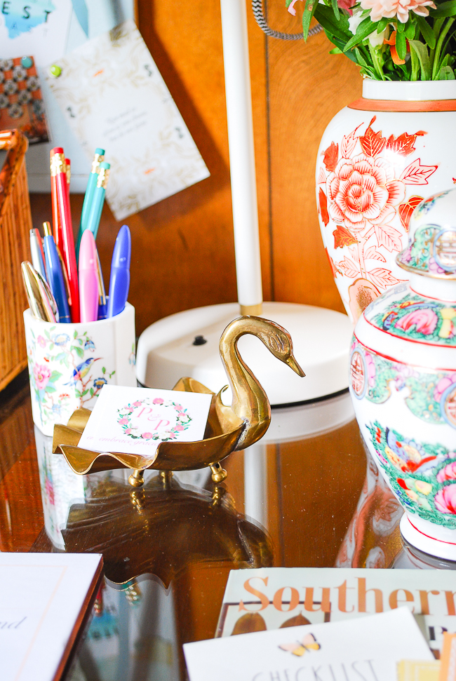 Vintage brass swan card holder for desk organization - an important tip for productivity when working from home