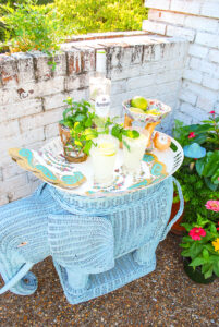 Vintage wicker elephant stand used as bar for coconut mojitos