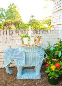 Summer decorating ideas: Vintage wicker elephant stand used as bar for coconut mojitos