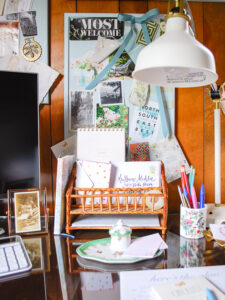 Home office desk with bamboo mail organizer and cork boards