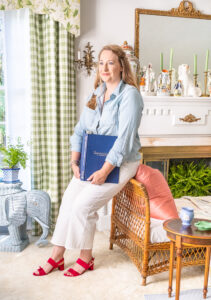Katherine in her living room wearing casual work outfit and pink sandal from Sarah Flint