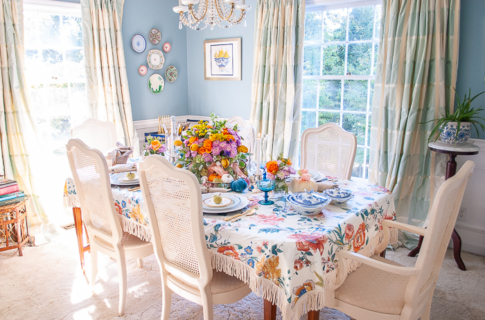 Panoramic view of dining room with table set for autumn