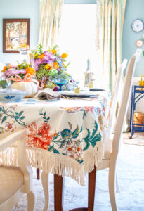 Detail photo showing bullion fringe on vintage chintz cloth for fall tablescape