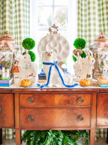 Antique mahogany sideboard with Staffordshire flatbacks, Rose Medallion temple jars, and an oyster plate