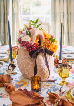 Swan centerpiece with autumn florals and velvet bow