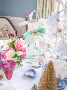 Vintage flower earring on mint green bow as ornament