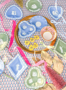 Materials laid out to turn vintage trinket dishes into ornaments with Flatirons disc plate hangers