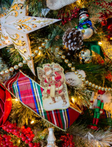 Vintage paper Santa ornament on our traditional Christmas tree
