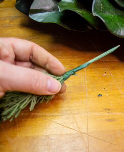 wrapping floral tape around wire to secure