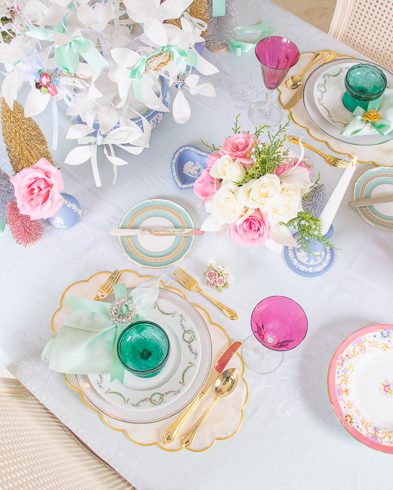 Antique german china, tiara glassware, capiz shell placemats, and vintage jewelry create a dreamy pastel tablescape for Christmas