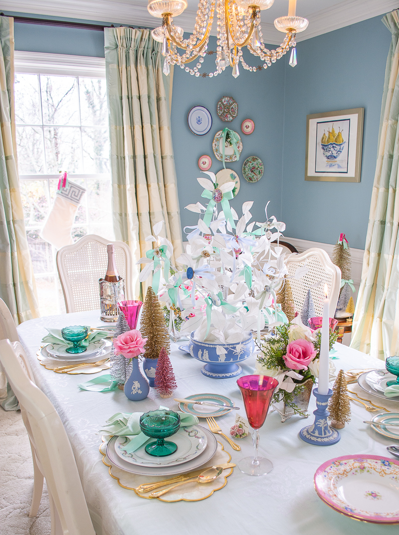Angle view of dreamy pastel Christmas table dressed up in Jasperware and vintage jewelry
