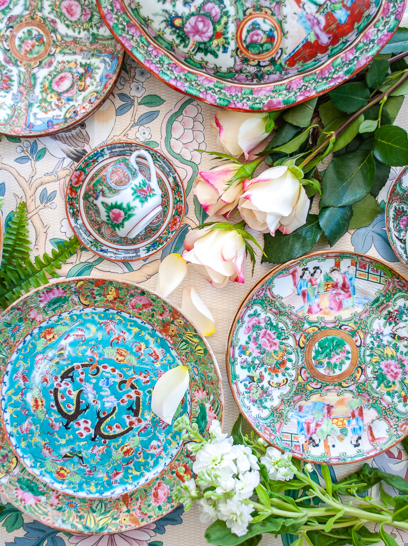 Flat lay image of various Famille Rose porcelains from the Chinese export market, featuring Rose Medallion