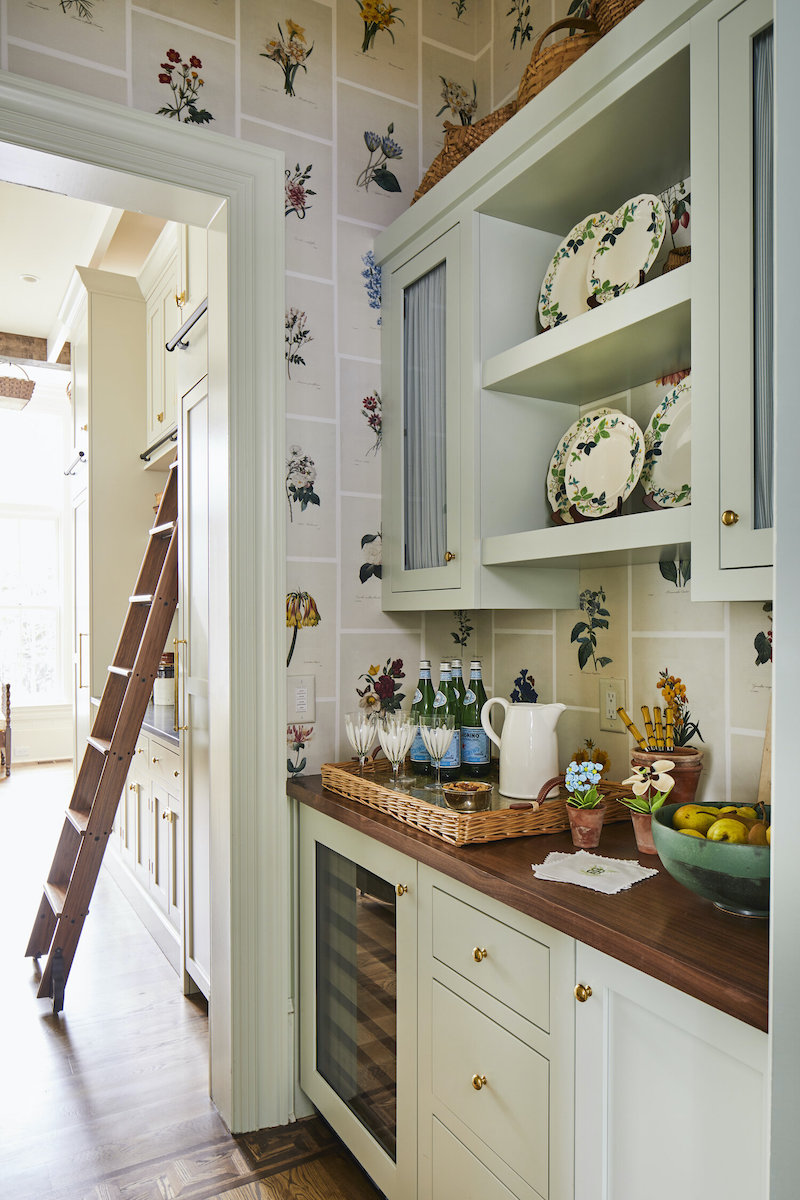 Butler's pantry in pale green with botanical wallpaper