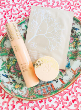 Arbonne products part of my winter skin care routine laid on Rose Medallion plate with pink background