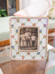 Ceramic floral frame holds family photo of Katherine's grandparents
