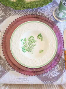 Wedgwood Patrician Robert soup bowls on a purple glass charger and white lace tablecloth