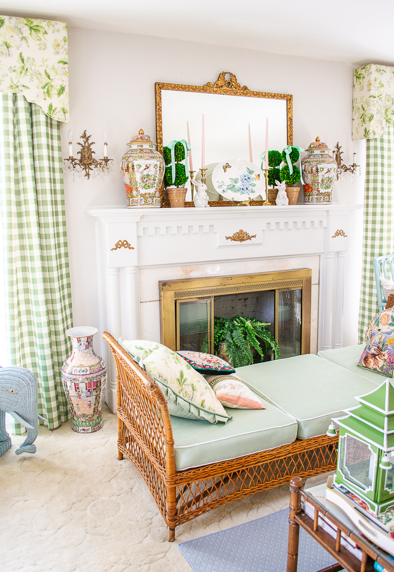 Spring mantel in Katherine's grandmillennial living room with boxwood topiaries, mint green bows, white bunnies, and Lenox butterfly meadow platter