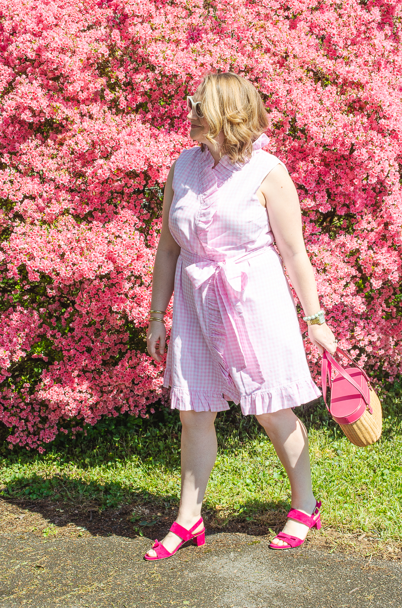 Katherine in spring dress in front of pink azalea bush