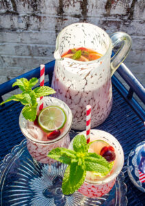 Summer pitcher cocktail with cherry lemonade and vodka