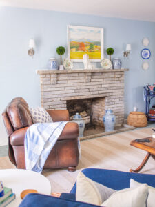 Blue and white family room reveal with new art and Chinoiserie porcelain at fireplace