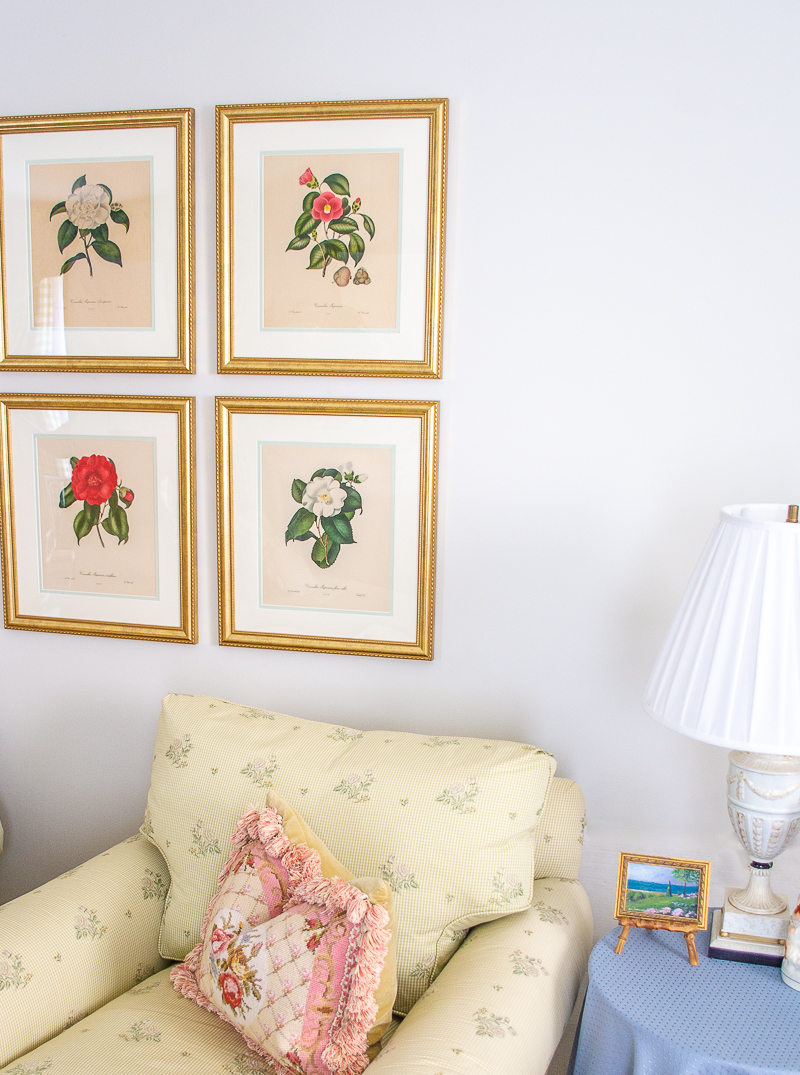 Angled view of camellia prints on wall in grid style layout