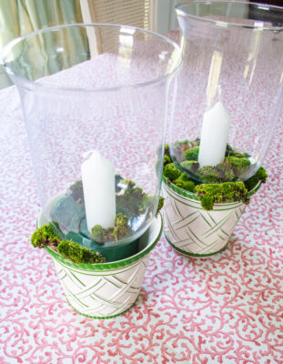 DIY mossy hurricane lanterns with green and white planters