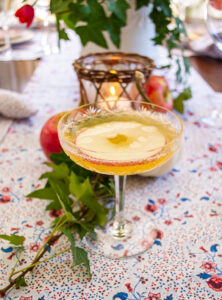 apple cider mimosa in an etched champagne coupe