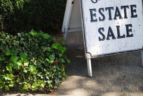 white and black estate sale sign 