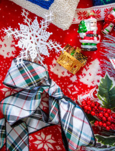 Après ski at the Christmas Lodge is my second inspiration for traditional Christmas decorating this year. This flat lay features reindeer, fair isle sweaters and motifs, plaid ribbon, and whimsical ski decor