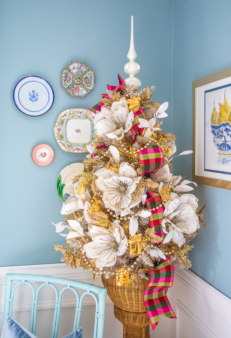 Small dining room tree with white magnolia, plaid ribbon, and Danbury Mint gold ornaments on vintage platinum tree