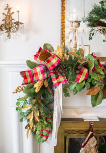 Detail view of my magnolia pine garland with pink and green plaid ribbon