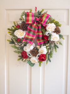 Transform a mixed evergreen wreath from Target into a beautiful bespoke Christmas wreath red and white blooms