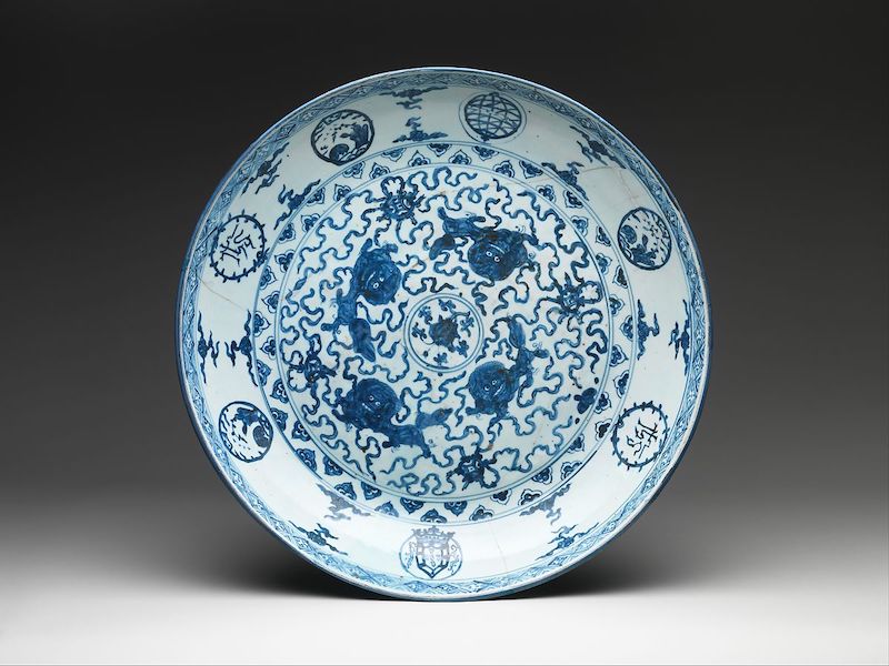 Mid-16th century blue and white porcelain dish produced for Portuguese market with IHS and armillary sphere