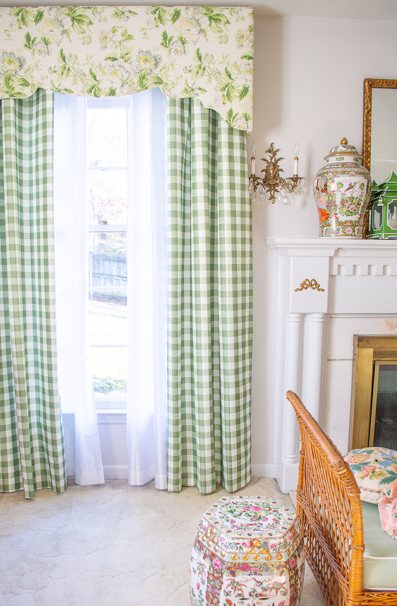Window treatments in Katherine's living room with chintz cornice and gingham curtains