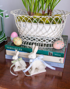 Department 56 bisque bunnies with pretty bows add a spring touch to the sideboard