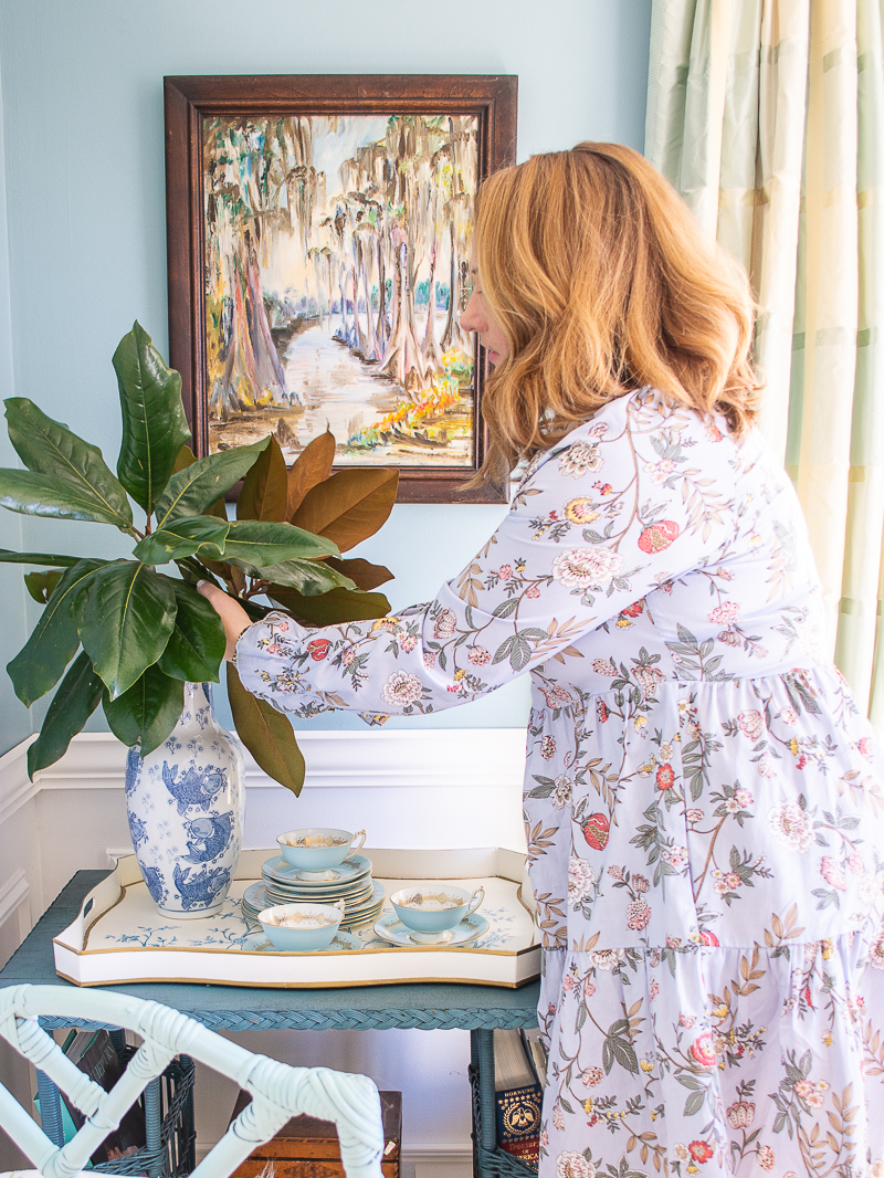 Katherine styling magnolia in a blue and white vase for a classic pairing of blue and green