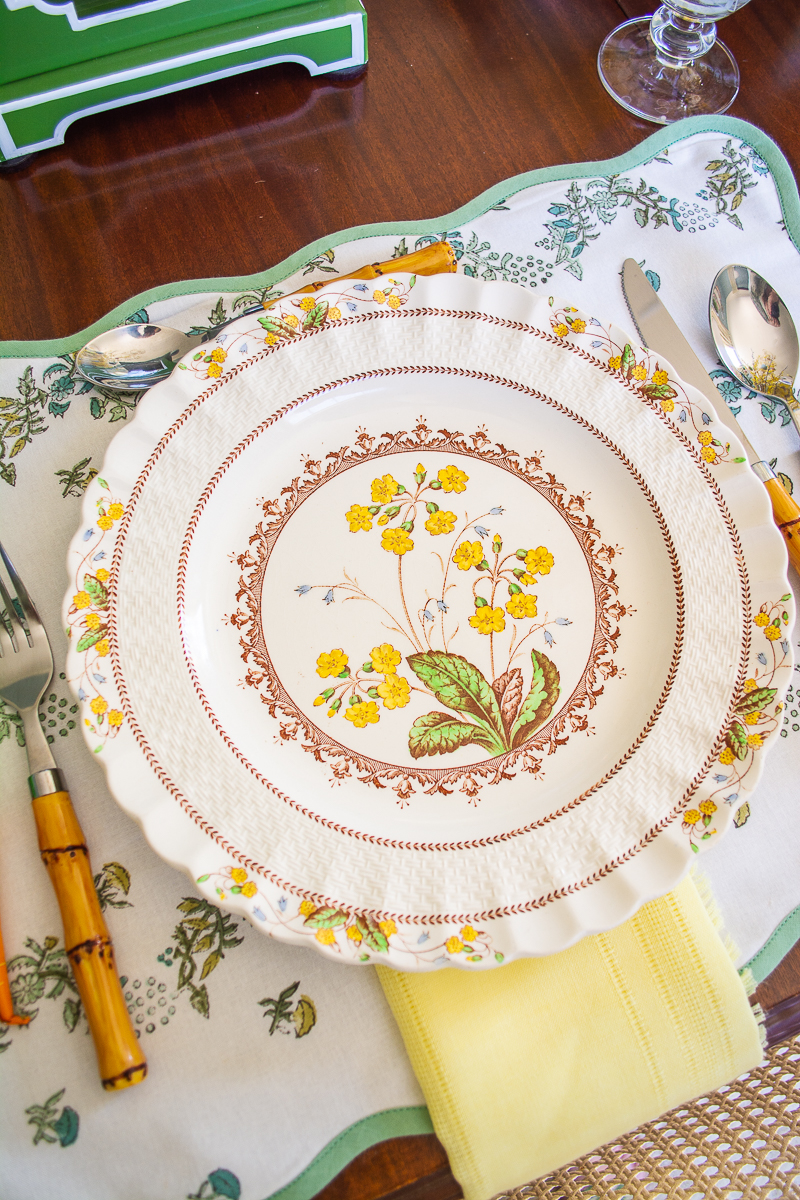 Detail of Copeland Spode Wicker Dell plates with yellow primroses 