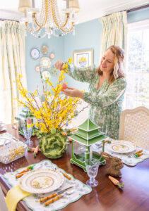 Katherine places egg ornament on yellow bell Easter egg tree centerpiece