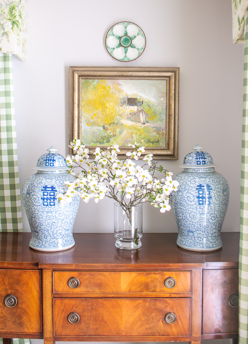 Flowering dogwood branches freshen up this traditional sideboard
