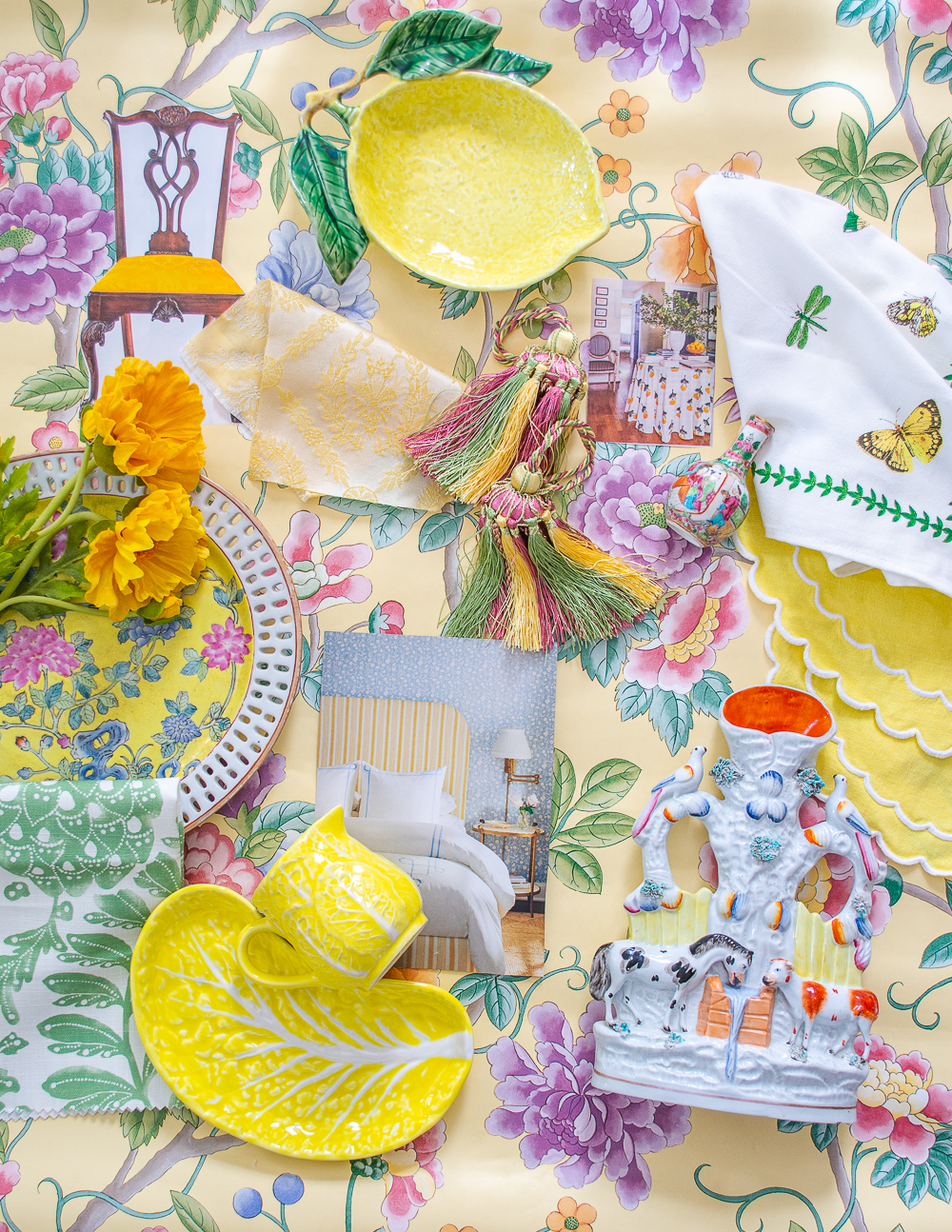 Decorating with yellow flat lay with yellow ceramics, fabric, wallpaper, and decorative accents