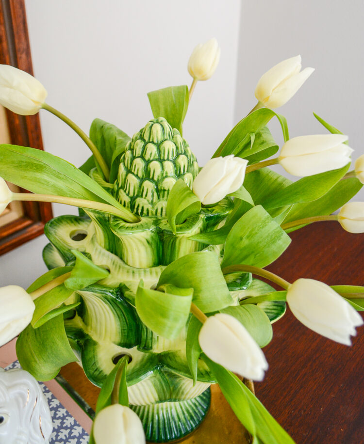 Large green artichoke tulipiere with white tulips