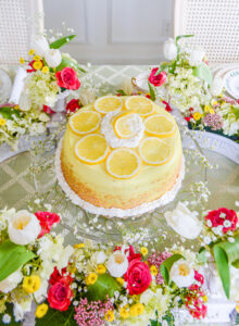 Lemon cake centerpiece decorated with white icing and lemon slices
