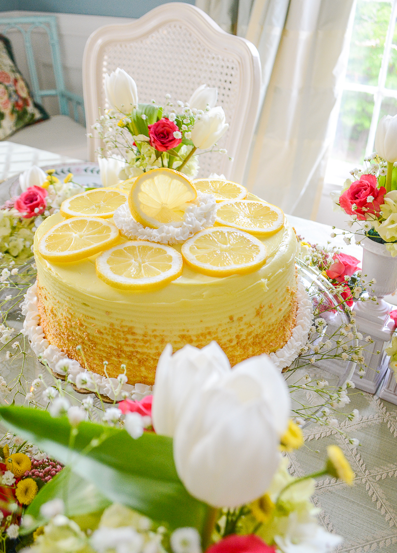 Lemon cake decorated with lemon slices and white icing