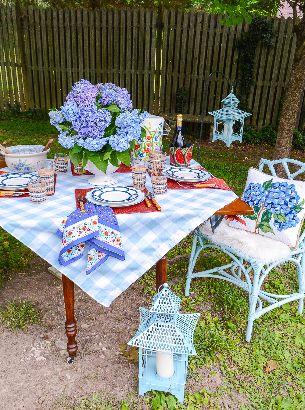 Summer al fresco in the garden dinner inspiration in blue and white with pops of red for a festive feel perfect for July parties