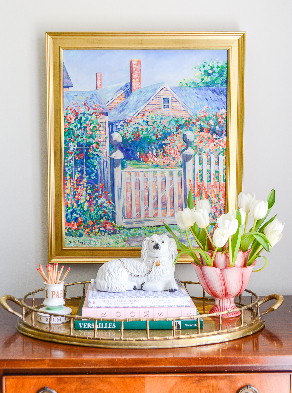 Use trays and books in your vignettes to achieve a layered look