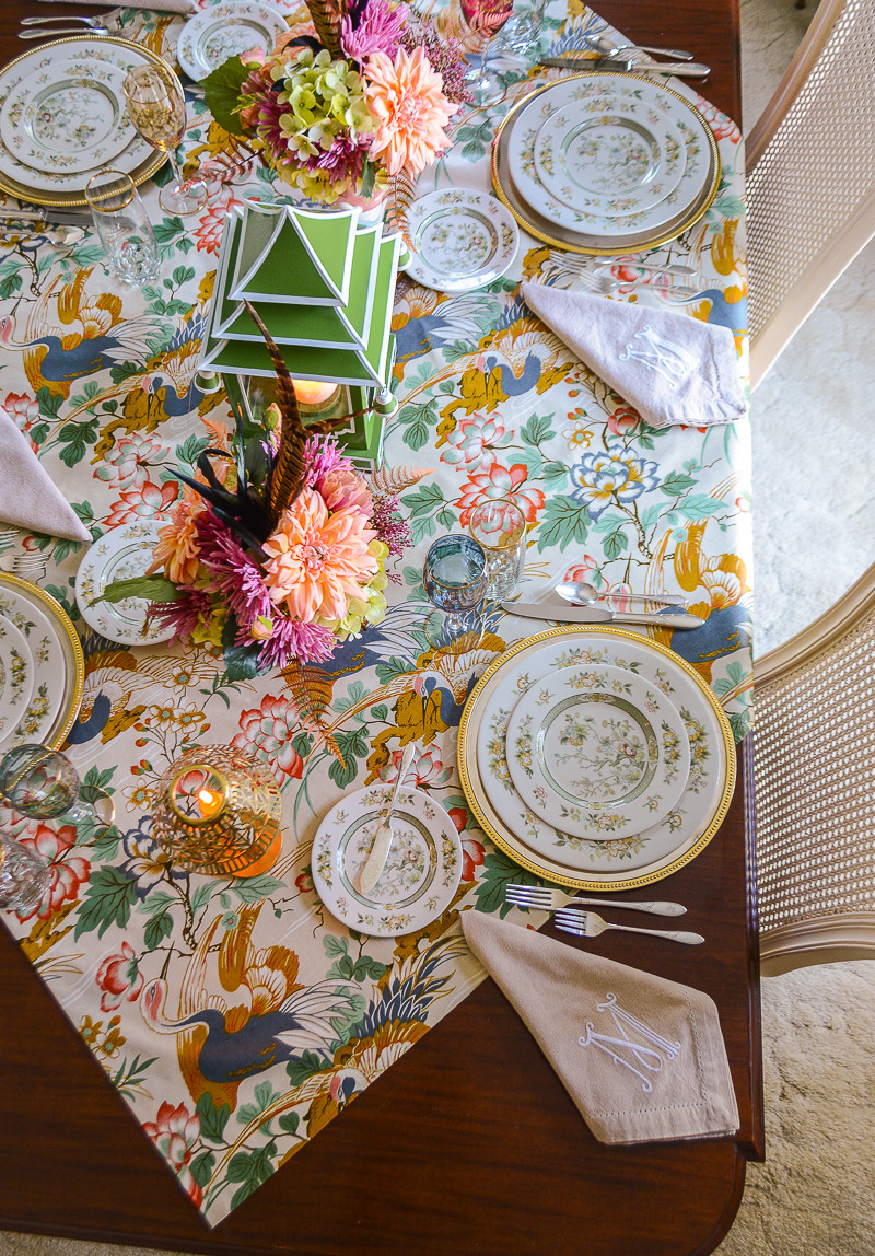The table runner is made from a Chinoiserie chintz fabric with cranes, peonies, and lotus blossoms