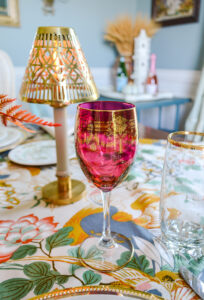 Colored Bohemian wine glasses add to the lush look of this fall tablescape