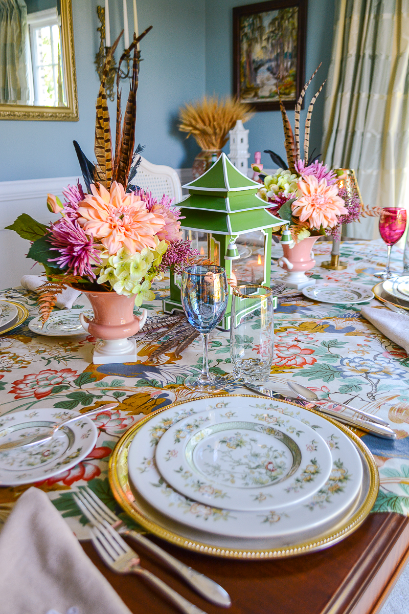 Welcome fall with a Chinoiserie inspired tablescape filled with elegant china, sparkling metallics, lush fabrics, and colorful florals.